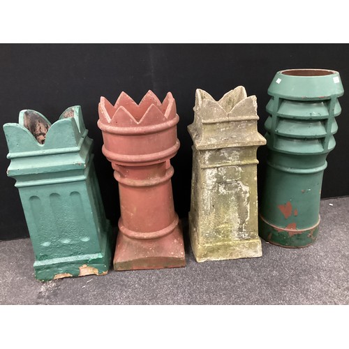 122 - Architectural salvage - a crown top chimney pot, 72.5cm high;  a Louvre chimney pot, 77cm high;  two... 