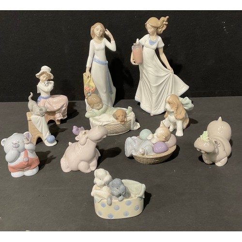 87 - A Spanish porcelain Nao figure, girl with long dress; others, girl with puppy, hippos, kittens, pupp... 