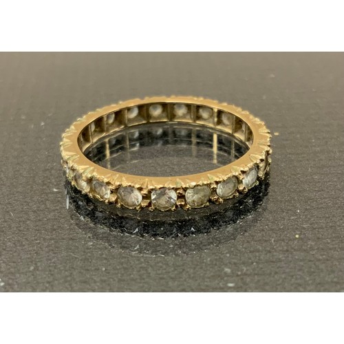 278 - Jewellery - a 9ct gold synthetic spinel eternity ring, stamped 9ct,  rolled gold hinge bangle, white... 