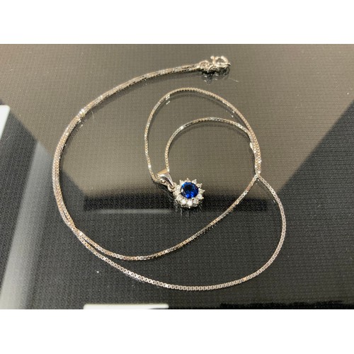 294 - A blue and white cubic zirconia pendant necklace, 925 silver mount box link chain, 3g gross.