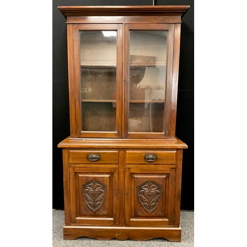 150A - A late Victorian mahogany bookcase cabinet, out-swept cornice, above pair of glazed doors enclosing ... 