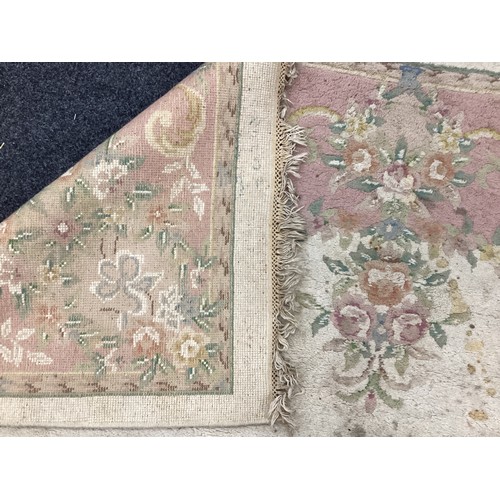 162A - A large Chinese woven wool rug,in tones of pink, cream and green, 284cm x 225cm; another 350cm x 251... 