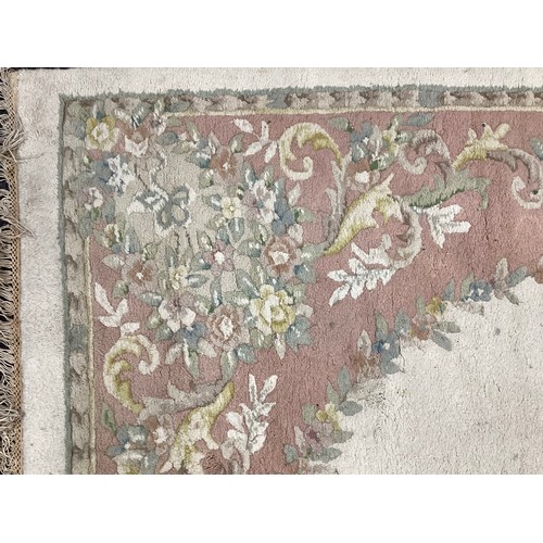 162A - A large Chinese woven wool rug,in tones of pink, cream and green, 284cm x 225cm; another 350cm x 251... 