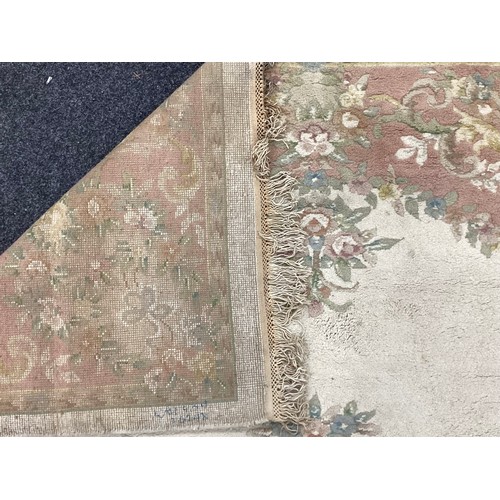 162A - A large Chinese woven wool rug,in tones of pink, cream and green, 284cm x 225cm; another 350cm x 251... 