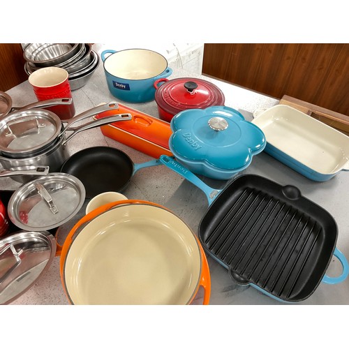 167 - Cookery and Kitchen equipment - Le Creuset - signature lidded cast iron casserole, two stainless ste... 