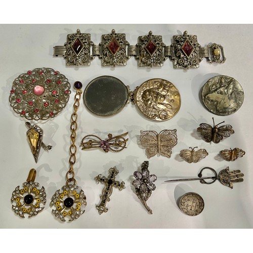 127 - A silver filigree butterfly brooch, three others smaller; a Hamsa hand stick pin; other decorative f... 