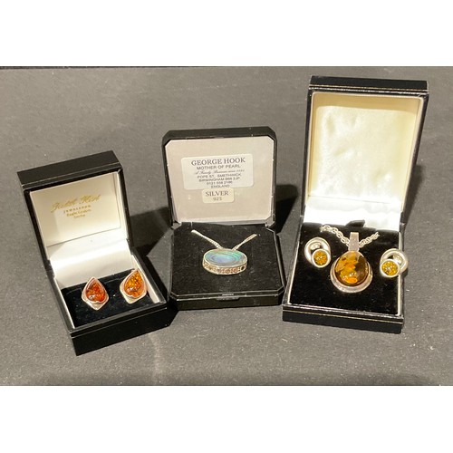 139 - A sterling silver and polished amber necklace and earrings set, boxed; a pair of silver and amber ea... 