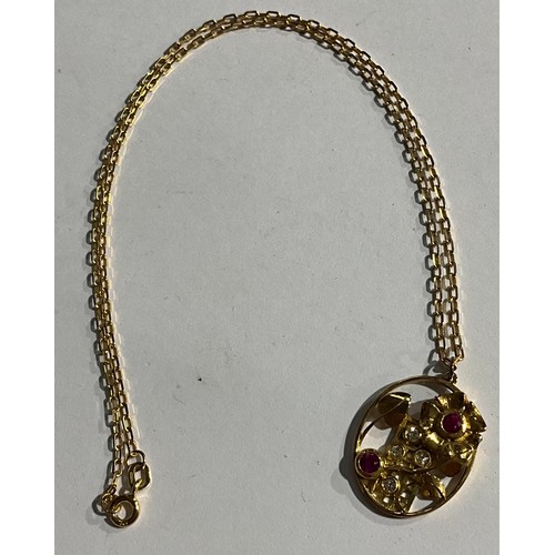 153 - An unmarked gold openwork oval pendant, set with ruby and diamond stones, as flowers growing up a tr... 