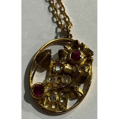 153 - An unmarked gold openwork oval pendant, set with ruby and diamond stones, as flowers growing up a tr... 