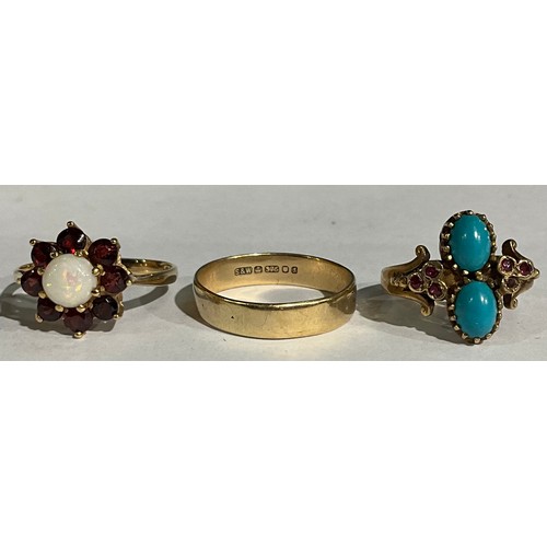 160 - A Victorian style 9ct rose gold ring, set with a pair of polished oval turquoise cabochon, flanked b... 