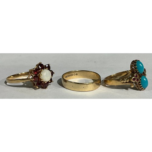 160 - A Victorian style 9ct rose gold ring, set with a pair of polished oval turquoise cabochon, flanked b... 