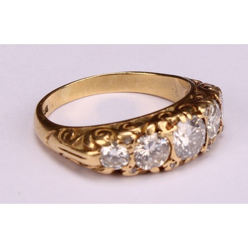 166 - An 18ct gold five stone diamond ring, the graduated stones interspersed with diamond chips, estimate... 