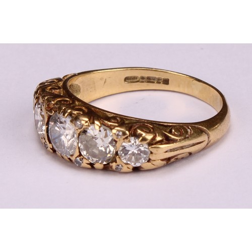 166 - An 18ct gold five stone diamond ring, the graduated stones interspersed with diamond chips, estimate... 