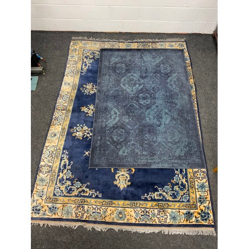 111 - A Chinese silk and wool mix rug, central floral medallion within blue ground, stepped floral borders... 