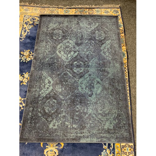 111 - A Chinese silk and wool mix rug, central floral medallion within blue ground, stepped floral borders... 