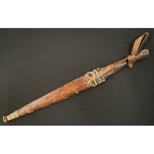 2074 - African Dagger with double edged blade 290 mm in length. Leather bound grip. Overall length 430 mm. ... 