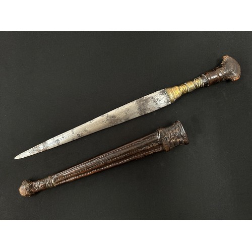 2075 - Dagger with double edged blade 260 mm in length. Blade decorated with punch mark patterns. Brass gri... 