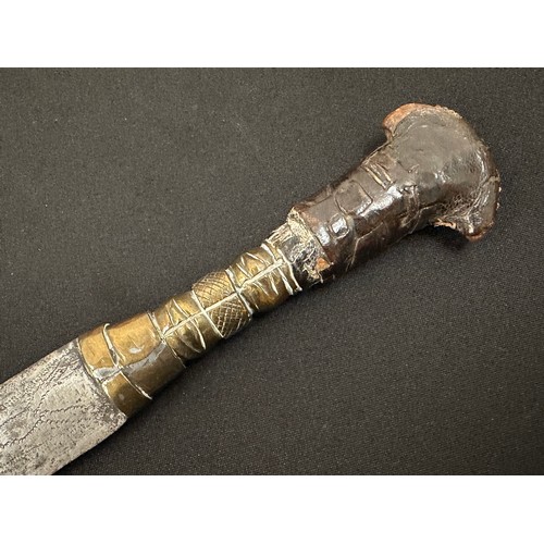 2075 - Dagger with double edged blade 260 mm in length. Blade decorated with punch mark patterns. Brass gri... 