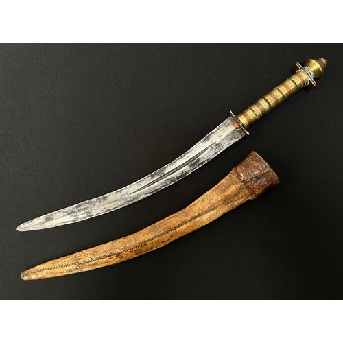 2076 - Dagger with curved double edged fullered blade 314mm in length. Decorative grip made from brass, cop... 