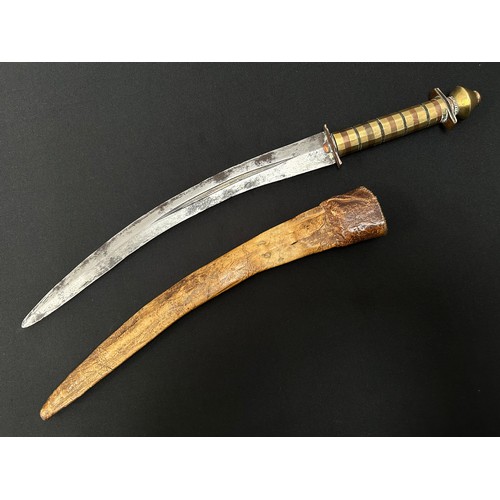 2076 - Dagger with curved double edged fullered blade 314mm in length. Decorative grip made from brass, cop... 