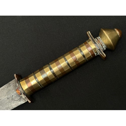 2076 - Dagger with curved double edged fullered blade 314mm in length. Decorative grip made from brass, cop... 