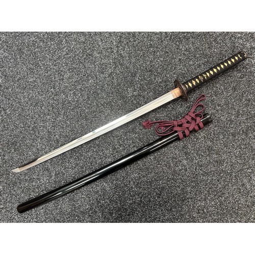 2093 - Japanese Katana Sword with single edged blade 640mm in length. Visible Hamon line. Tang is signed 