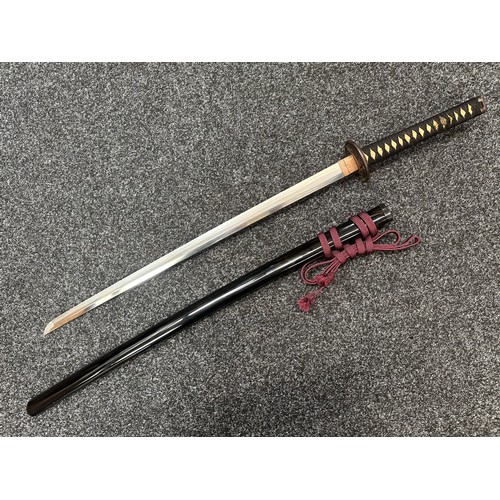 2093 - Japanese Katana Sword with single edged blade 640mm in length. Visible Hamon line. Tang is signed 