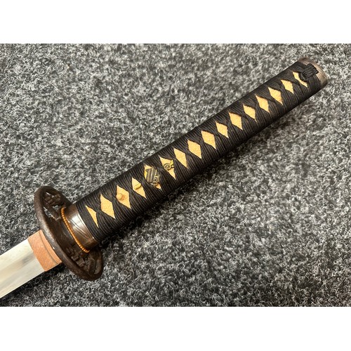 2093 - Japanese Katana Sword with single edged blade 640mm in length. Visible Hamon line. Tang is signed 