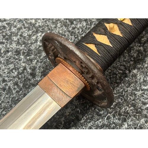 2093 - Japanese Katana Sword with single edged blade 640mm in length. Visible Hamon line. Tang is signed 