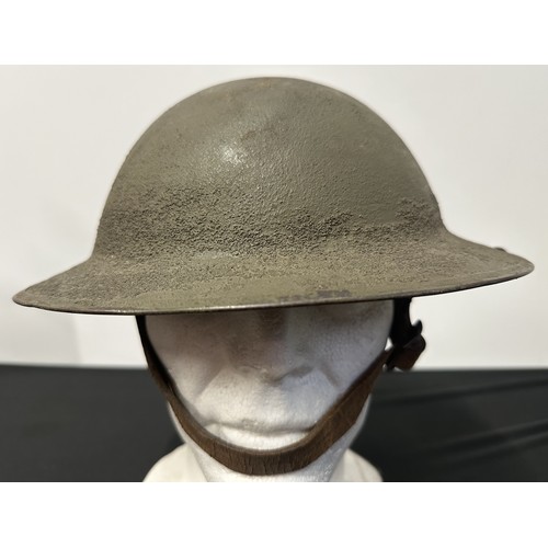 2097 - WW1 US M1917 Steel Helmet. Three holes have been drilled to each side of the rim to allow fitment of... 