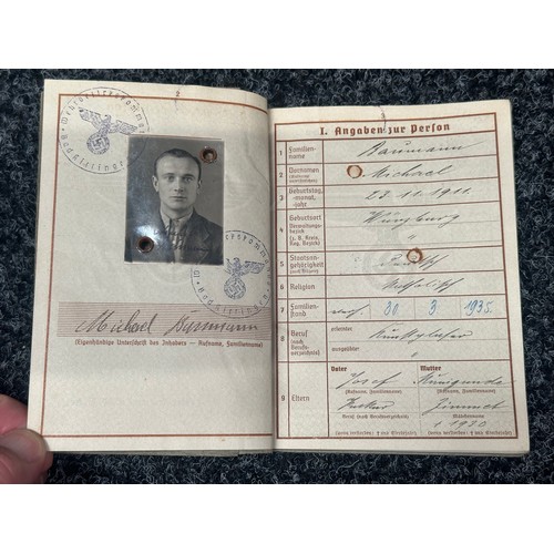 2158 - WW2 Third Reich Heer Wehrpass to Michael Baumann with complete with photograph. Awarded the Drivers ... 