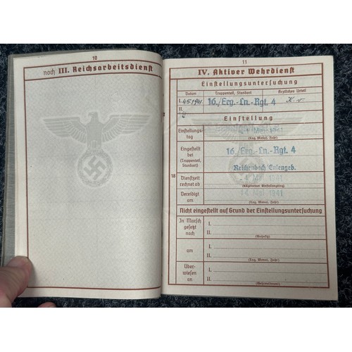 2158 - WW2 Third Reich Heer Wehrpass to Michael Baumann with complete with photograph. Awarded the Drivers ... 