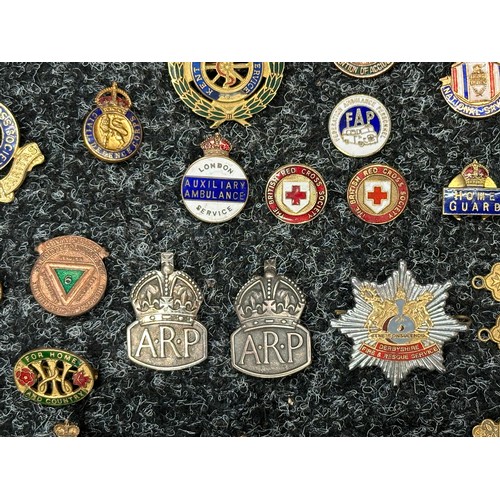 2272 - A collection of enamel lapel badges to include Royal British Legion, WVS Civil Defence, Womens Land ... 