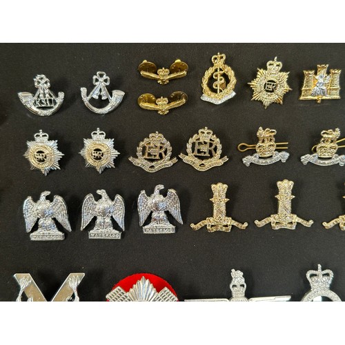 2318 - Post War British Army ERII Staybrite Cap badges, collar dogs, shoulder titles and buttons.