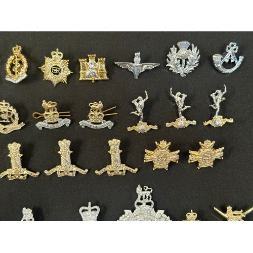 2318 - Post War British Army ERII Staybrite Cap badges, collar dogs, shoulder titles and buttons.