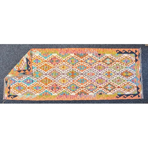 389 - Oriental Rugs and Carpets - a Chobi Kilim runner, 237cm x 90cm