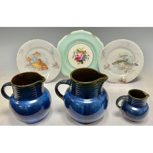 393 - A set of three Denby Danesby Ware Electric Blue graduated jugs, the largest 16cm; a Royal Crown Derb... 