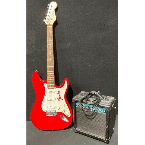 402 - An Alba Fender Stratocaster type electric guitar, cherry red; a CD-G15 electric guitar amplifier, 18... 