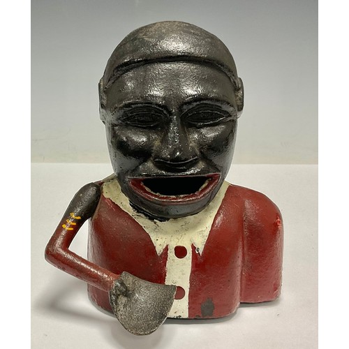 510 - A hand operated cast iron money bank