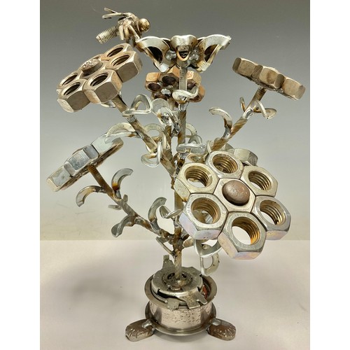 514 - Steam Punk - a sculptural table centre as a vase of flowers, constructed from car parts, nuts and bo... 