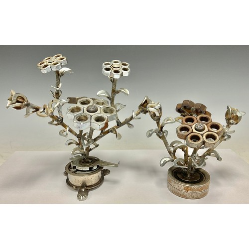 515 - Steam Punk - a sculptural table centre as a vase of flowers, constructed from car parts, nuts and bo... 