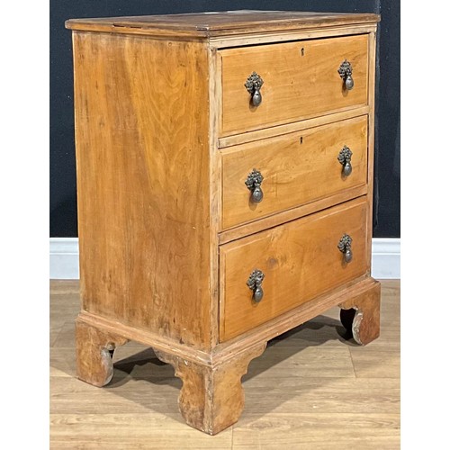 523 - An early 20th century walnut and mahogany chest, of small proportions, rectangular top above three l... 