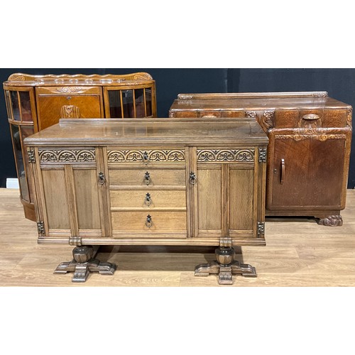 527 - A mid-20th century Post-Art Deco oak sideboard, 100.5cm high, 138cm wide, 52.5cm deep; another, Eliz... 