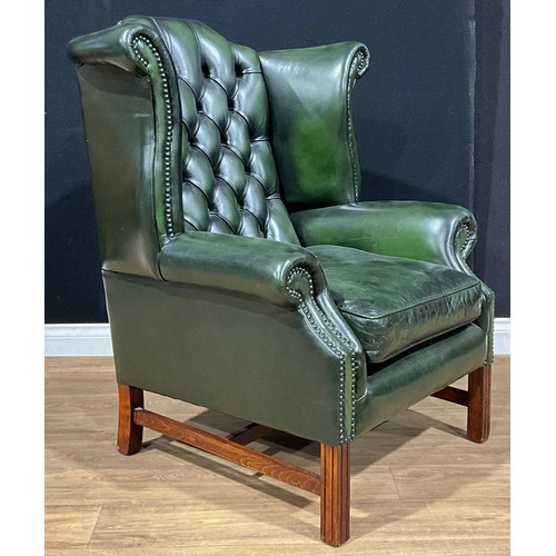 530 - A contemporary George III style Chesterfield wing chair, 106cm high, 88cm wide, the seat 45cm wide a... 