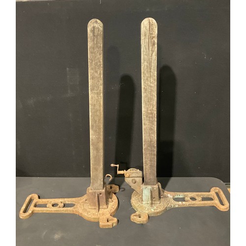 557 - A pair of Ayres Patent 'The Cavendish Tennis Posts', cast iron bases, oak uprights, 106.5cm high, ea... 