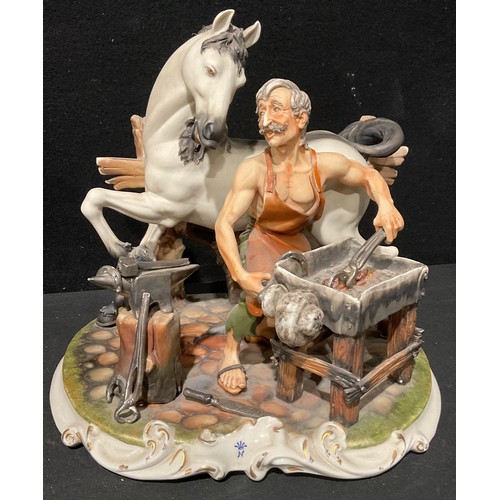 563 - A large Capodimonte figure group, of a blacksmith/farrier shoeing a horse, signed M. Lozy, 18cm high... 