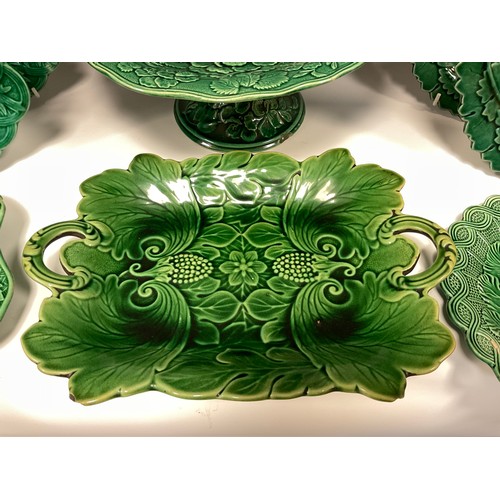 340 - A pair of Wedgwood majolica shallow leaf dishes, impressed marks, 24cm wide; another pair unmarked, ... 