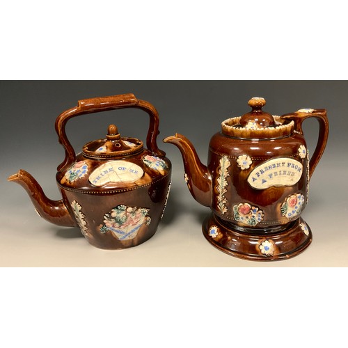 336 - A 19th century Measham Bargeware  teapot and stand, A Present from a Friend 21cm high overall, anoth... 