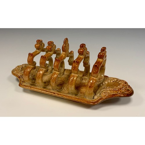 373 - A 19th century S. & H. Briddon, Brampton brown salt glazed stone ware five bar toast rack, in relief... 