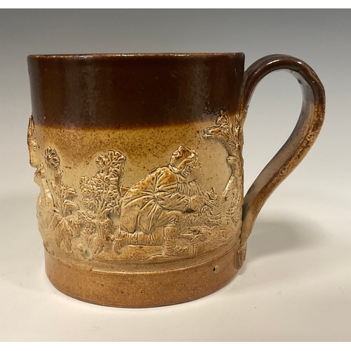 370 - A 19th century Brampton stoneware coffee pot and cover, relief decorated with Dogs and Figures, flor... 